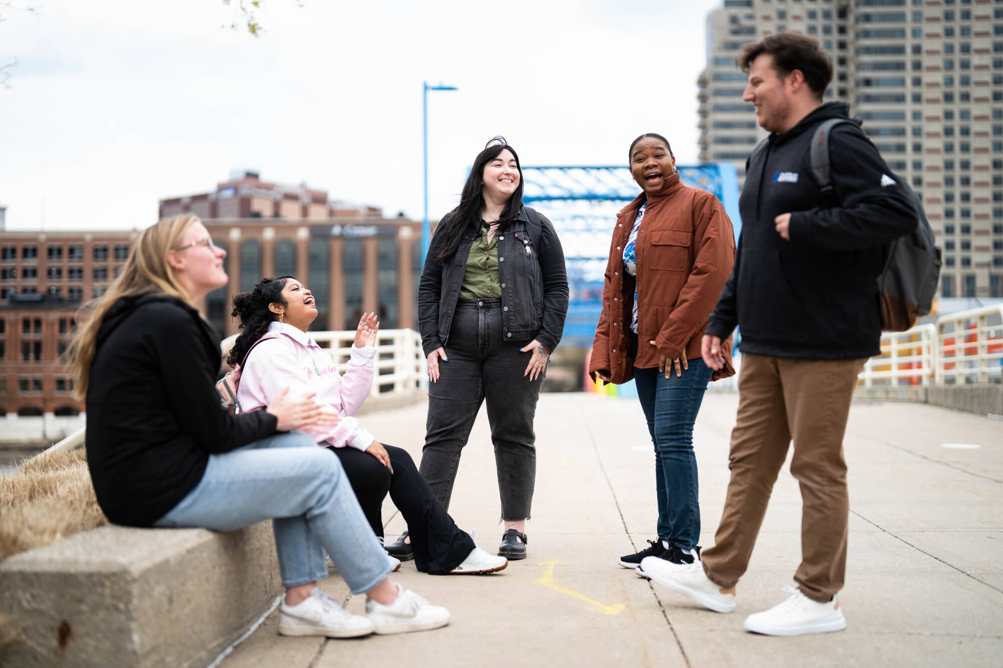Students talking in front of the Blue Bridge